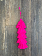 Load image into Gallery viewer, handmade cotton tassel with 5 tiers.  Hot pink.  About 10 inches from top of tassel to bottom.  Extra 4 inches of string to hang it with.
